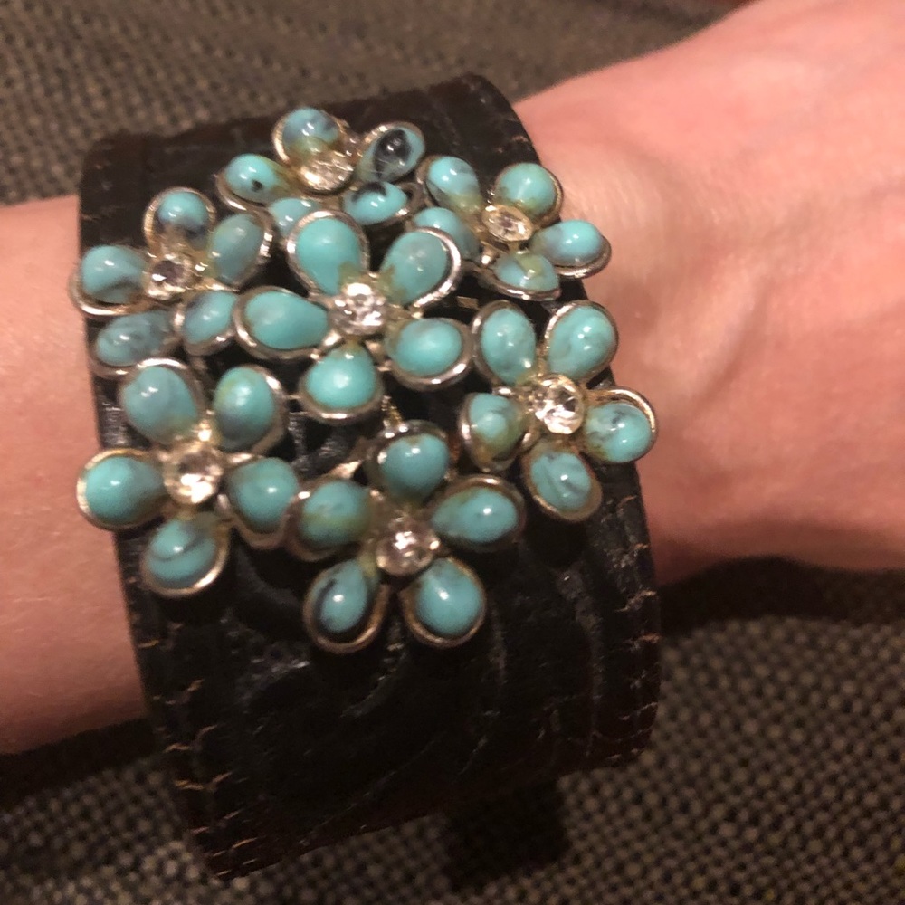 Custom leather cuff with vintage brooch accent
